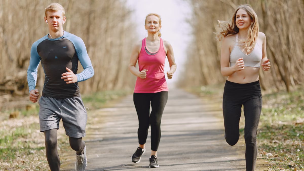 Three adults jogging on a park path, embracing a healthy and active lifestyle.