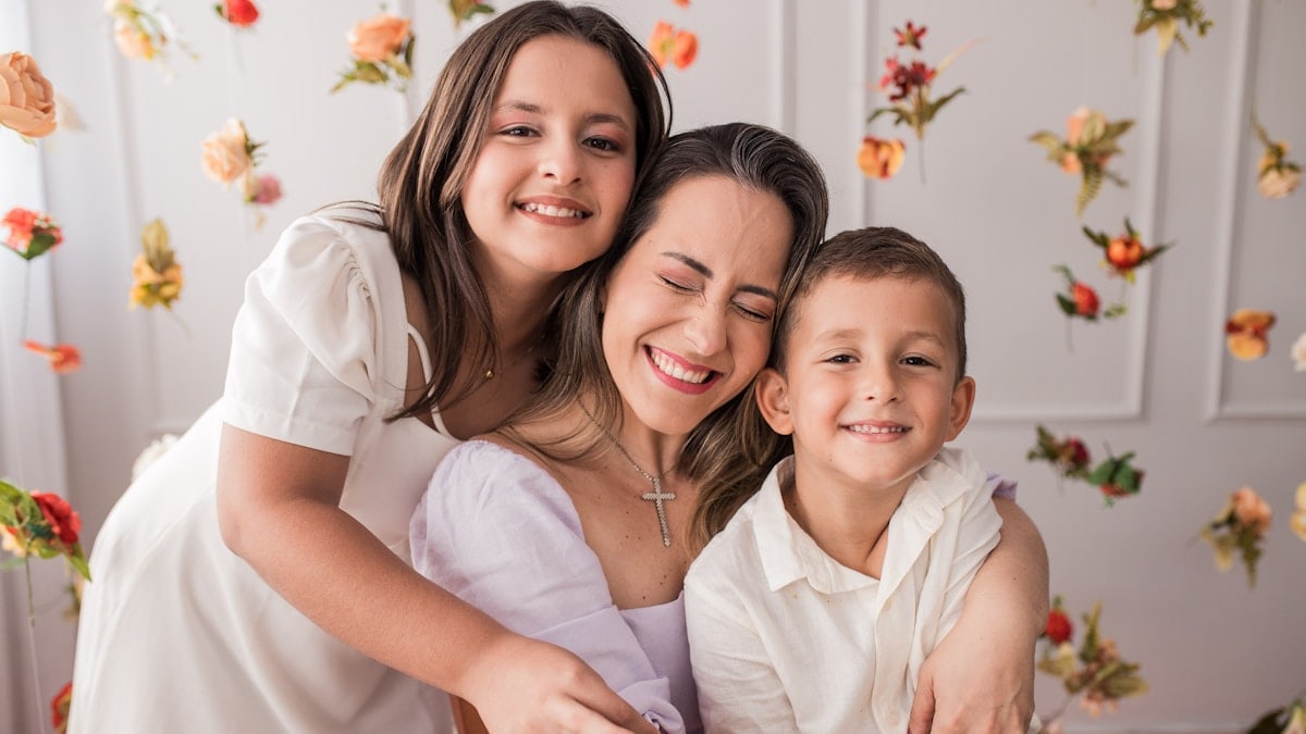 a woman and two children posing for a picture